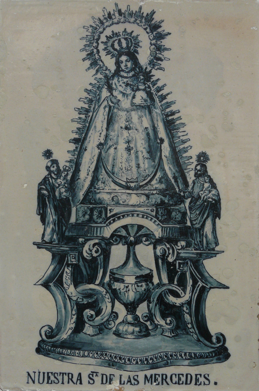 00820. Retablo cerámico. Virgen de las Mercedes. Cruz de los Labradores. Bollullos Par del Condado. Huelva.